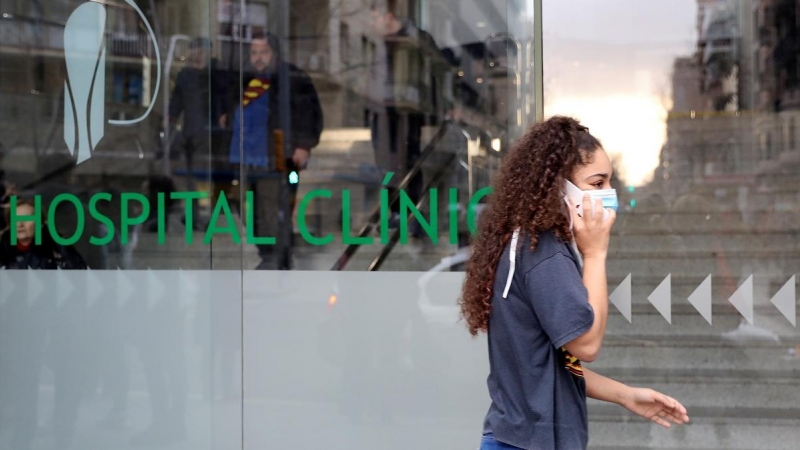 Woman in a protective face mask walks out of a Hospital Clinic, where a case of novel coronavirus has been confirmed, in Barcelona | reuters