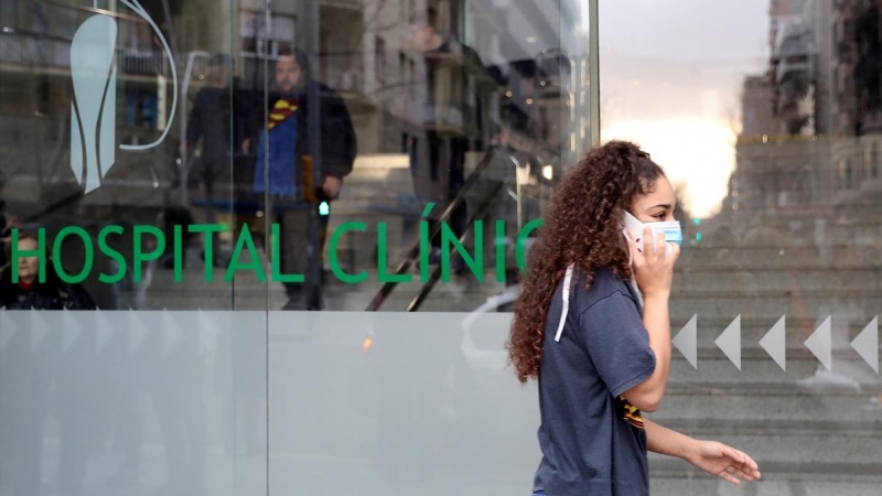 Woman in a protective face mask walks out of a Hospital Clinic, where a case of novel coronavirus has been confirmed, in Barcelona | reuters