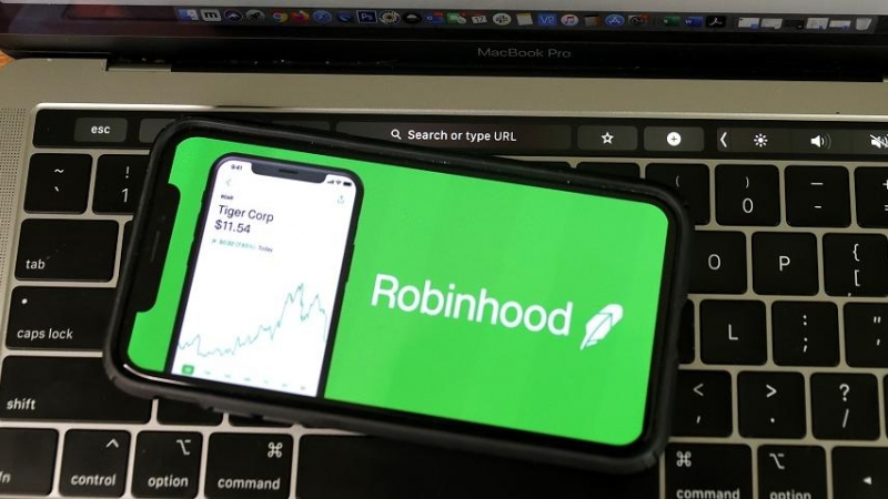 The Robinhood logo is displayed on an iPhone.