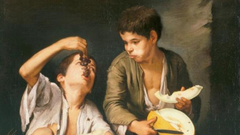 Niños comiendo uvas y melón