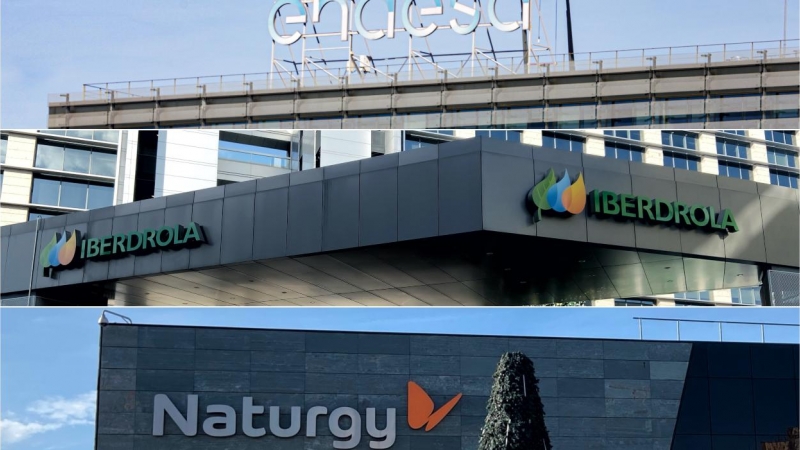Los logos de las tres principales compañías eléctricas (Endesa, Iberdrola y Naturgy), en sus sedes en Madrid. E.P.