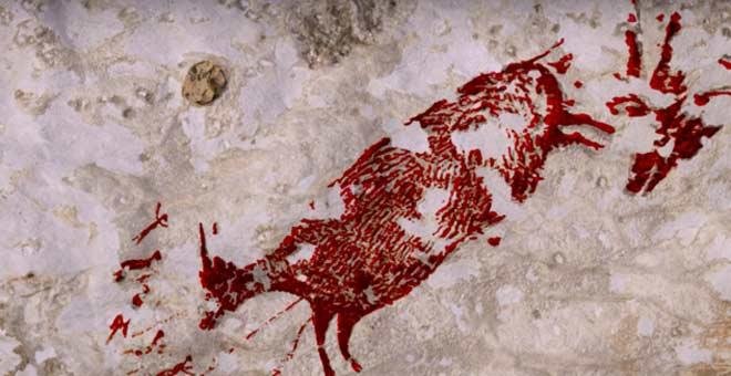 Descubren la pintura rupestre de caza más antigua del mundo en Indonesia
