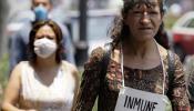México asegura que los casos por gripe porcina disminuyen